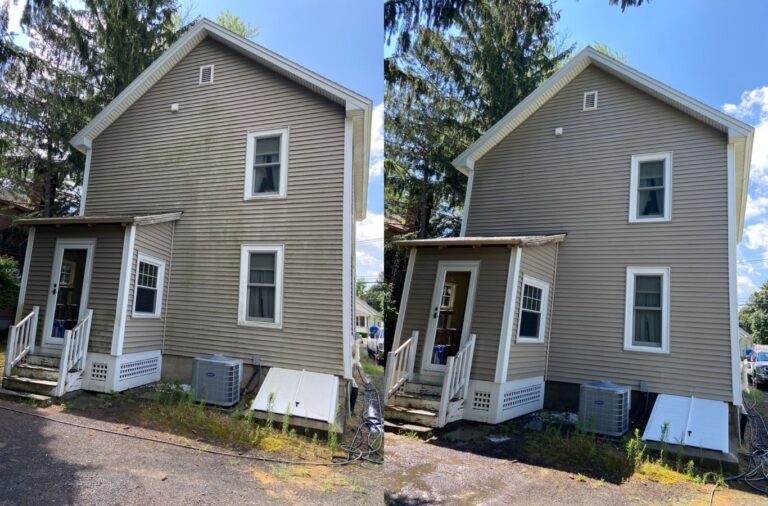 An Upstate Softwash professional demonstrating meticulous house washing techniques on a home in Halfmoon, NY, showcasing the company's commitment to quality service.​ House Washing near me.