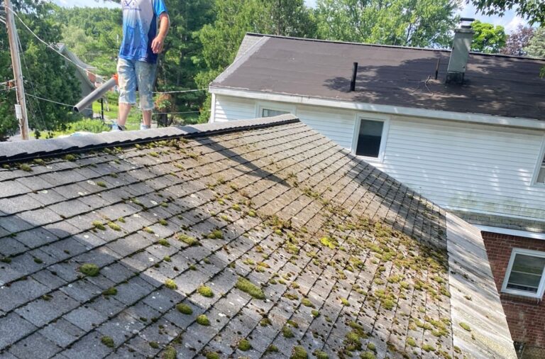 A Upstate Softwash team member performing detailed pressure washing in Brunswick, NY, emphasizing service quality and customer care.