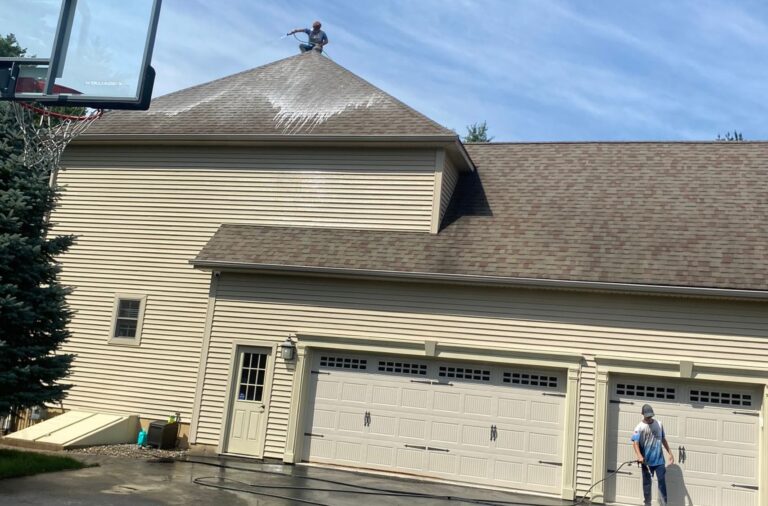 Upstate Softwash team member demonstrating the advantages of pressure washing services in Loudonville, NY.