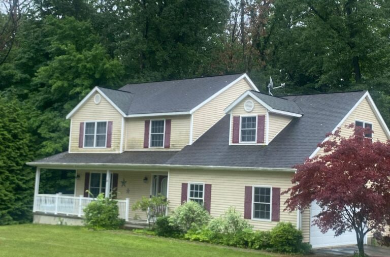 A Upstate Softwash expert applying pressure washing services in Brunswick, NY, illustrating the advantages of local, professional service. Pressure Washing near me.